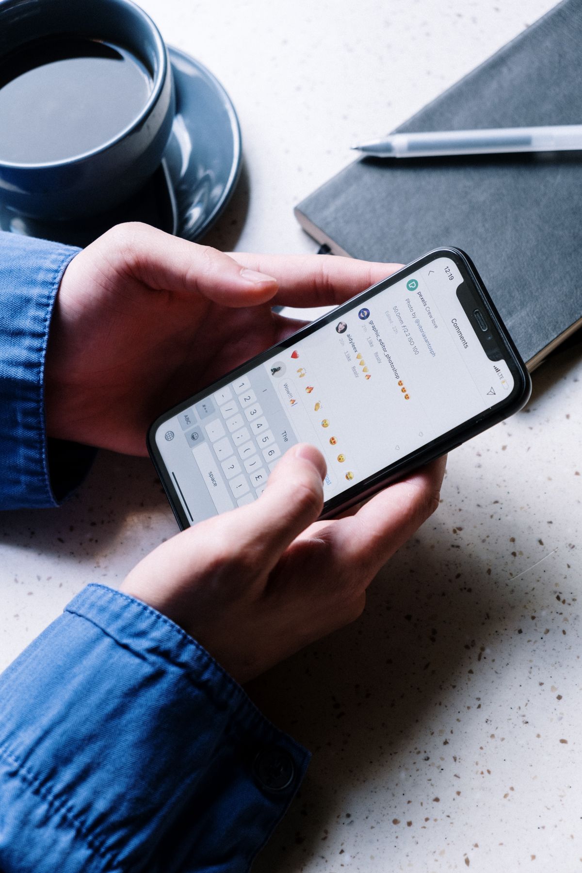 A guest reading a booking reminder message on their phone over coffee