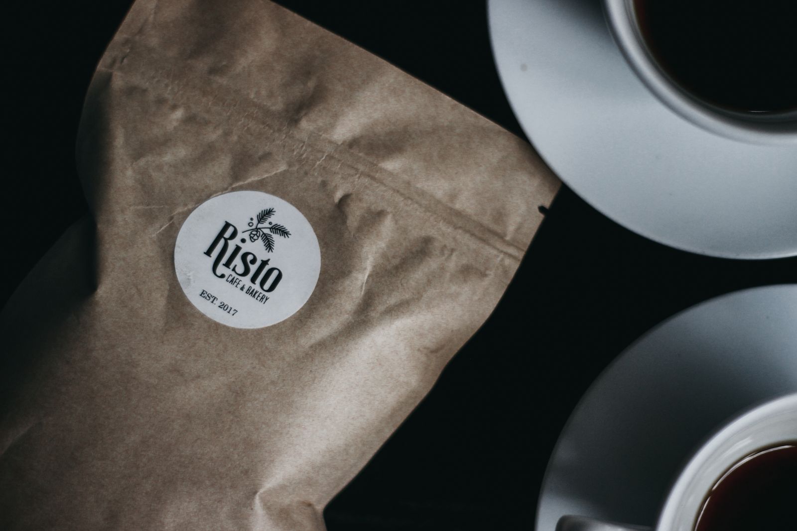A café's logo carried consistently across its cups and packaging