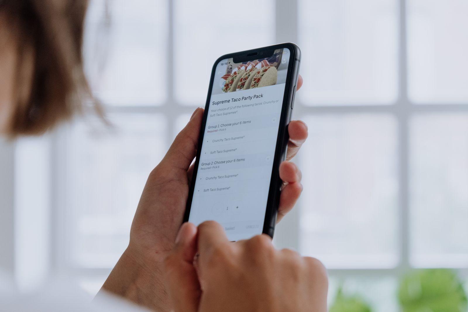 A customer ordering from a restaurant in a couple of taps on their phone